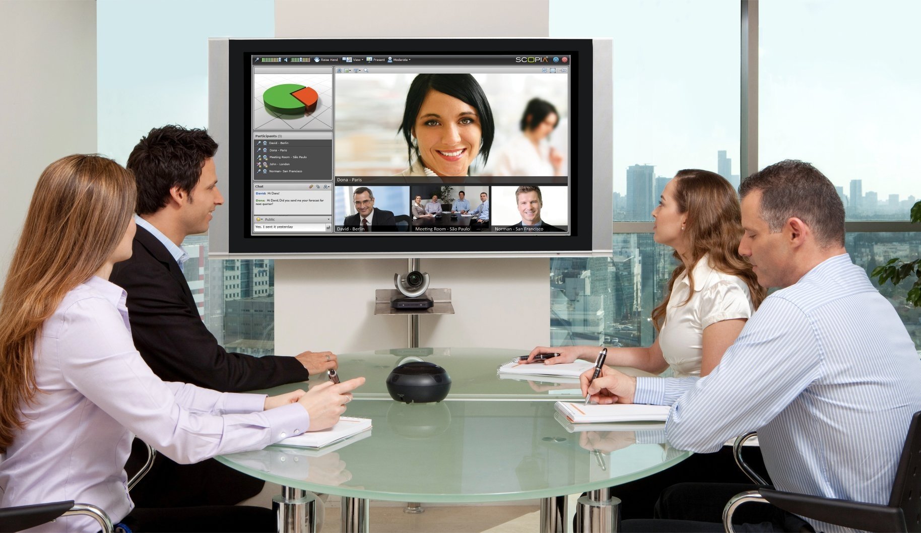 A team of people in an office on a videoconferencing call.